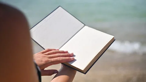 Two hands opening a book with blank page, Stock Video