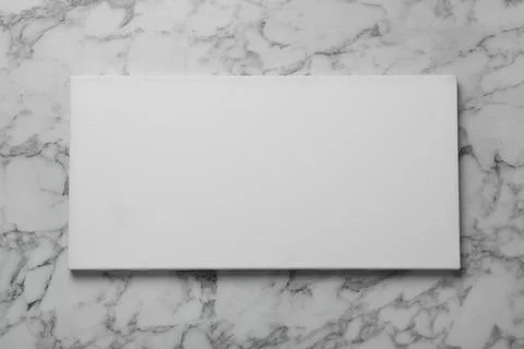 Blank canvas on white marble background, space for text Stockfoto's