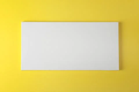 Blank canvas on yellow background, space for text Stock Photos