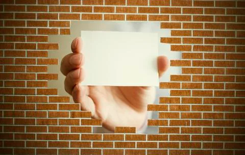 Blank card behind the wall Stock Photos