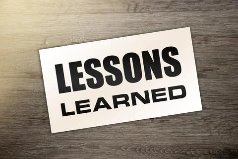 Blank card with text Lessons learned on wooden background. Business concept 库存照片