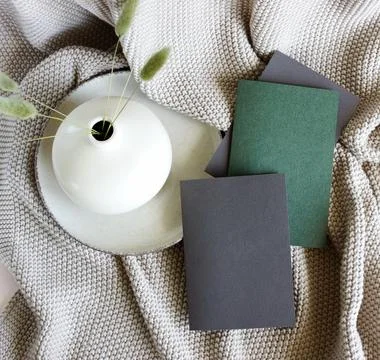 Blank cards mockup , vase with dry grass top view on beige knitting blanket.  Sp Stock Photos