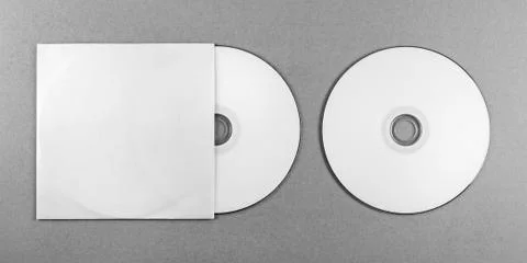Blank CD on gray Stock Photos