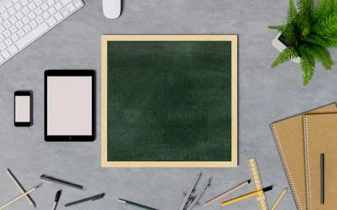 Blank chalkboard on table with Tablet and Smartphone. Top view of workspace. Stock Photos