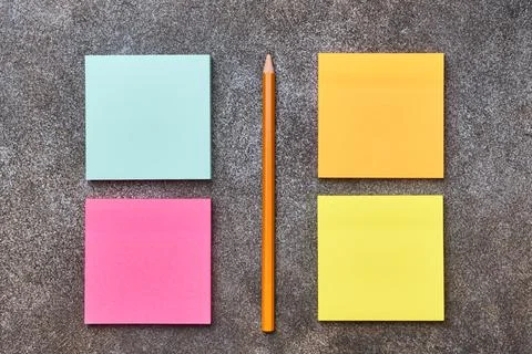 Blank colorful posts it note and pencil, flat lay, close up Stock Photos