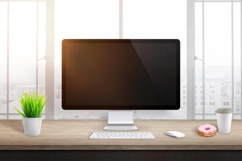 Blank computer display in office or workplace. Plant, coffee and donut beside Stock Photos