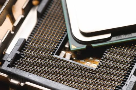 Blank cpu cpu socket with pins on motherboard in yellow color close-up Stock Photos