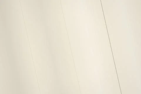 Blank cream-colored wall with subtle vertical lines Stock Photos