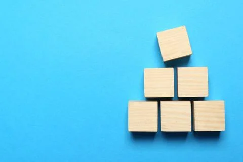 Blank cubes on light blue background, flat lay with space for text. Idea co.. Stock Photos