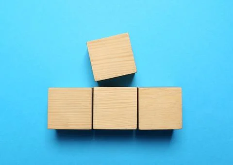Blank cubes on light blue background, flat lay with space for text. Idea co.. Stock Photos