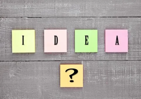 Blank different colors sticky note paper idea sign on wooden table Stock Photos