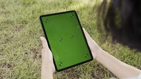 Blank digital tablet in the hands of Asian women, Tablet computer's green screen Stock Footage 115870348
