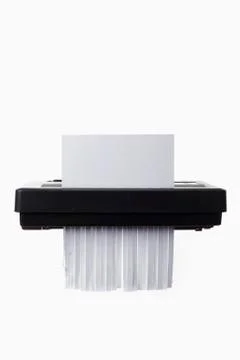 A blank document in a paper shredder Fotos de archivo