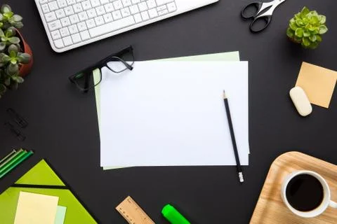Blank Documents Surrounded By Office Supplies On Gray Desk Stock Photos