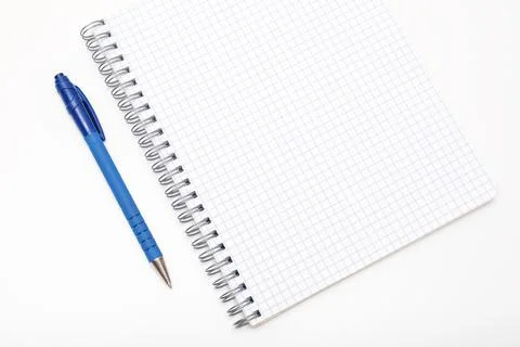 Blank empty spiral notebook with a pen on white table, study, education and Stock Photos