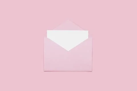 Blank empty white paper card in pink opened envelope isolated on pink background Stock Photos