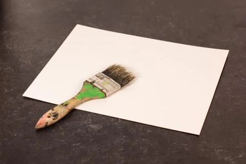 Blank empty white paper one dry but used paintbrush Stock Photos
