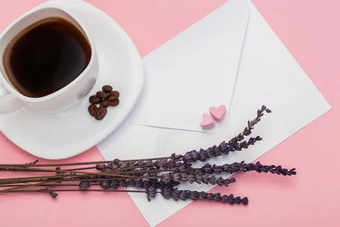 Blank envelope isolated and White cup full of coffee with roasted coffee beans Stock Photos