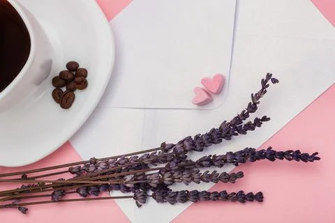 Blank envelope isolated and White cup full of coffee with roasted coffee beans Stock Photos