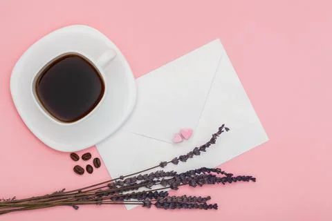 Blank envelope isolated and White cup full of coffee with roasted coffee beans Stock Photos