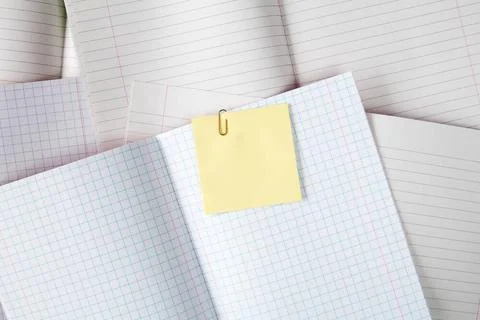 Blank exercise books with sticky note Blank exercise books with yellow sti... Stock Photos