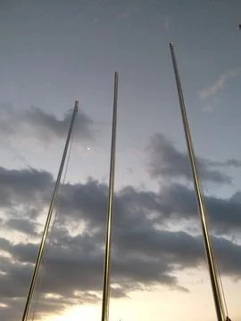 Blank flagpole on cloudy sky Stock Photos