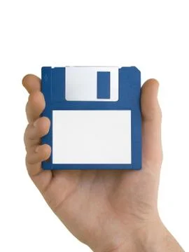 Blank floppy disc in hand Photos