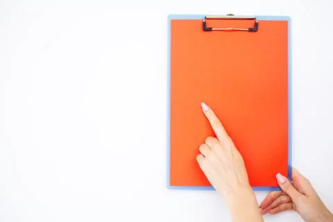 Blank Folder with range Paper. Hand that Holding Folder and Handle on White Stock Photos