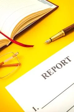 Blank form, notepad and pen for drawing up report on yellow table Stock Photos