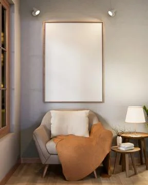 Blank frame with spotlight on wall over sofa chair with blanket and side ta.. Ilustración de archivo