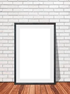 Blank frame in white brick wall with wooden floor texture interior room bac.. Stock Photos