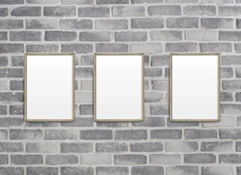 Blank frames on grey birck wall Illustrazione stock