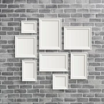 Blank frames on grey birck wall Illustrazione stock