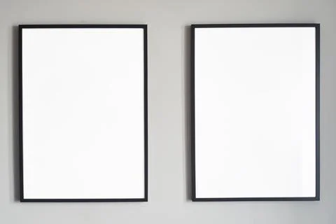 Blank frames on a wall create an ideal backdrop for artistic displays, enhancing Stock Photos