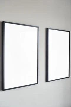 Blank frames on a wall create an ideal backdrop for artistic displays, enhancing Stock Photos
