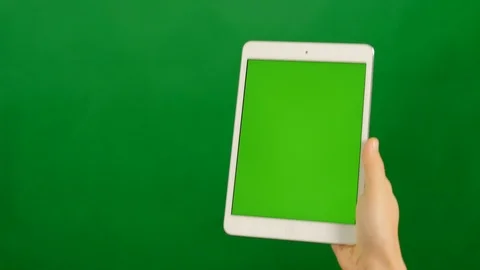 A blank green screen tablet on green background. 库存影片 88940167