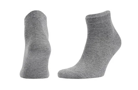 Blank grey cotton medium socks on invisible foot isolated on white background Foto stock