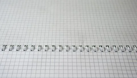 Blank grid paper waiting for creativity in a cozy workspace Stock Photos