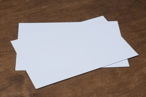 Blank horizontal postcard mockup placed on wooden table surface. Clean card.. Stock Photos