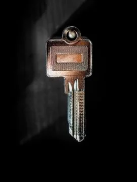 Blank key on a black  wall Stock Photos