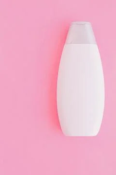 Blank label shampoo bottle or shower gel on pink background, beauty product and Stock Photos