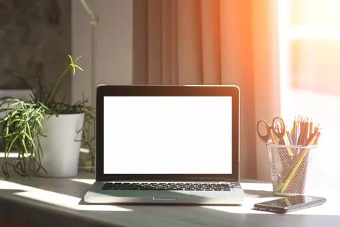 Blank laptop screen. Work or study online from home at a desk and laptop.. Stock Photos