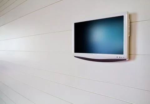 Blank LCD TV hanging on white wall Stock Illustration
