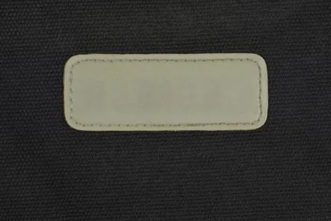 Blank Leather Patch on Black Fabric Texture 스톡 사진
