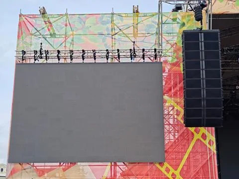 Blank LED screen and line array speaker hanging on an outdoor concert stage Fotos Stock