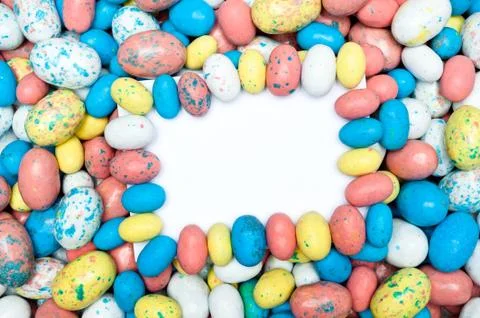 Blank message card in candy easter eggs Stock Photos