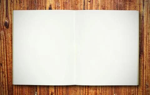 Blank note book on wood texture Stock Photos