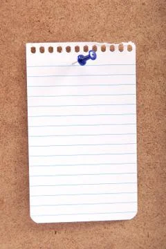 Blank note with button on a wooden board. Stock Photos