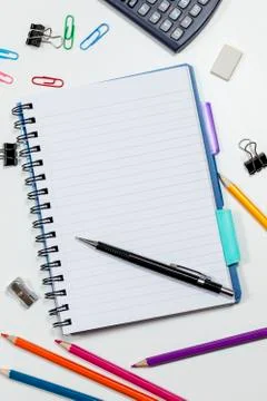 Blank note pad page on a busy white desk Stock Photos