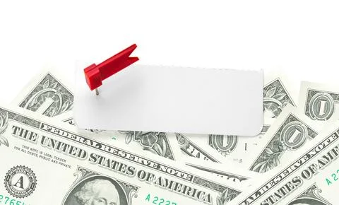 Blank note on a pile of money. Sheet of note paper with push pin on dollars.. Stock Photos